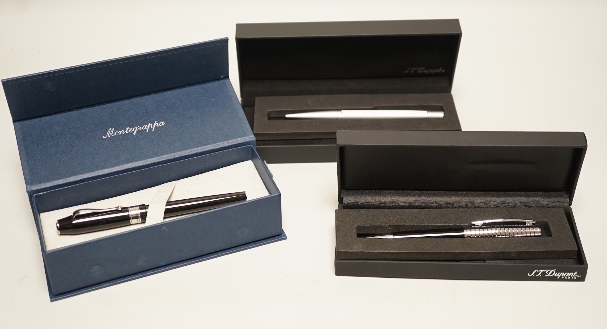 Two Dupont ballpoint pens and a Montegrappa Champions League Trophy fountain pen